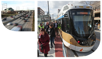 Gold and white streetcar boarding passengers at a station platform next to a busy highway.