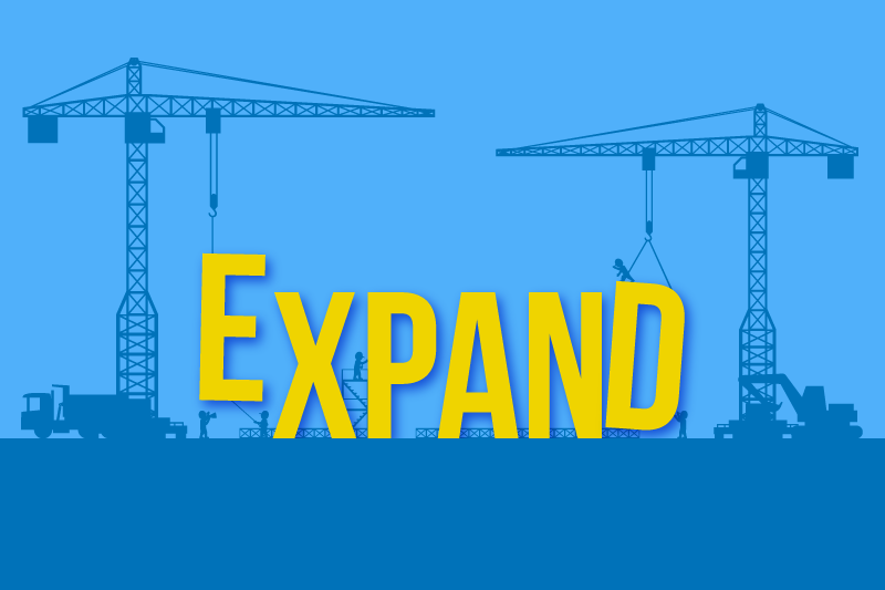 Yellow EXPAND text set against silhouettes of construction cranes and machinery.